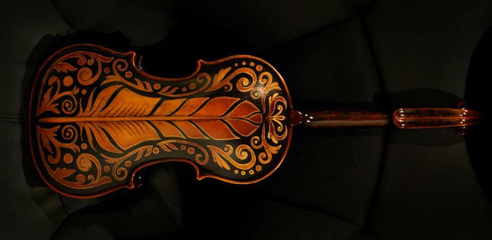 Feather black and gold design painted on to my violin.