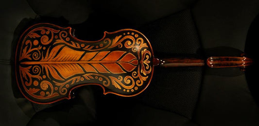Feather black and gold design painted on to my violin.